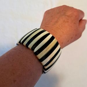 Black and white striped bracelet.
